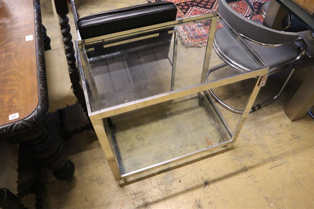 A contemporary chrome glass two tier tea trolley, width 79cm, depth 48cm, height 72cm